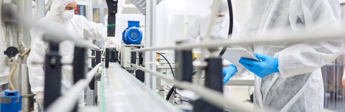 Supplement bottles moving along a manufacturing line